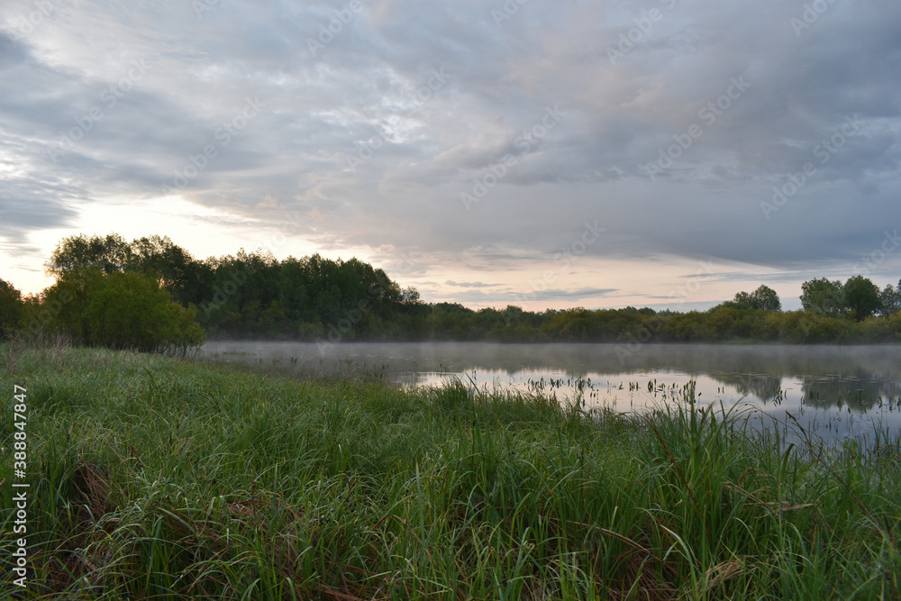 colorful and misty dawn over a small river colorful and misty dawn over a small river