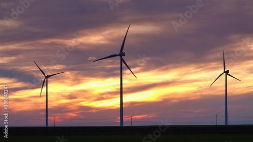 Wind turbine silhouette on beautiful sunset landscape 