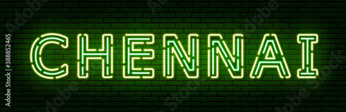 Glowing neon sign with the inscription of the Indian city of Chennai. In green and yellow colors. Against a brick wall. All elements are isolated.
