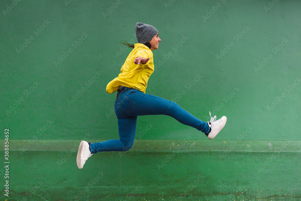 Young Girl Jumping in Street