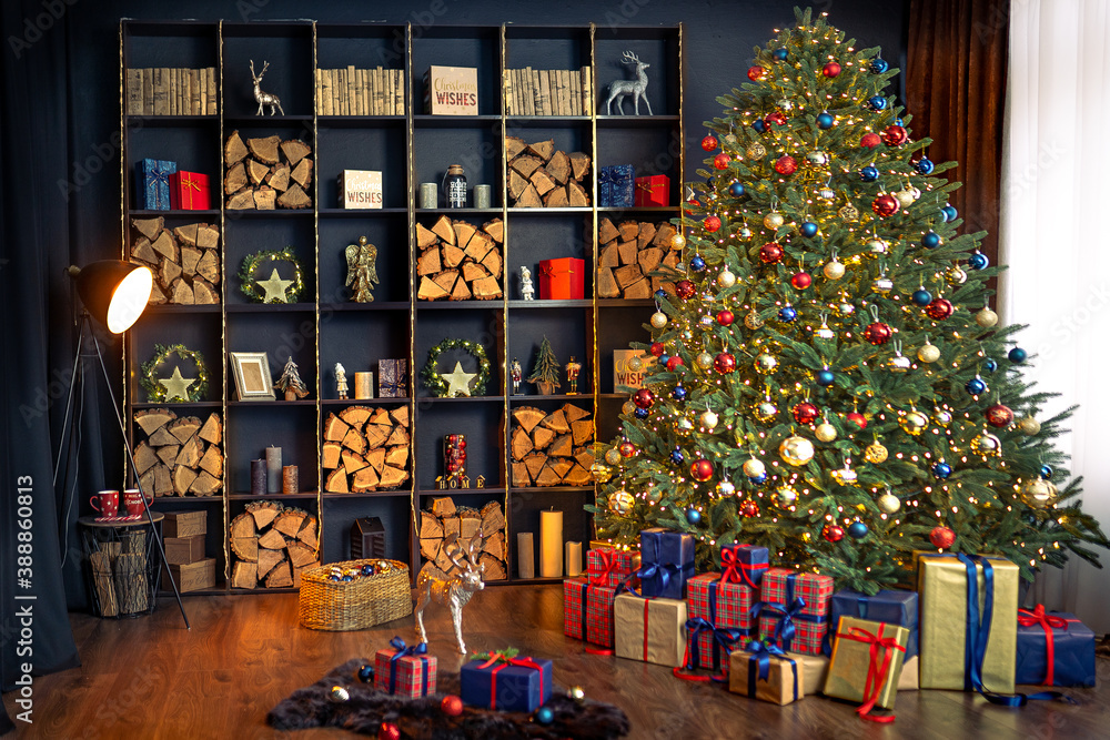 Christmas interior with bookshelves, christmas tree, boxes, chair in studio.