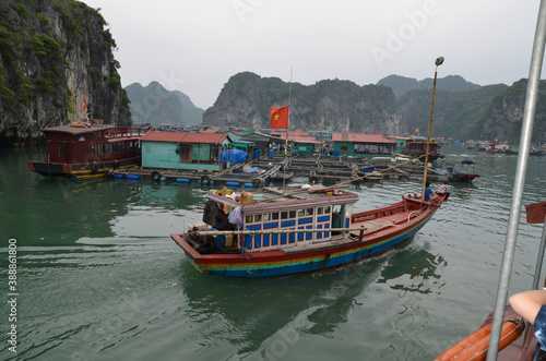 Small boat in the background of the fishing village. Vietnam. Halong.