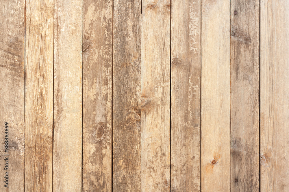 Naklejka premium Old wooden texture background. Wood wall surface with vertical planks. Light brown wooden boards.