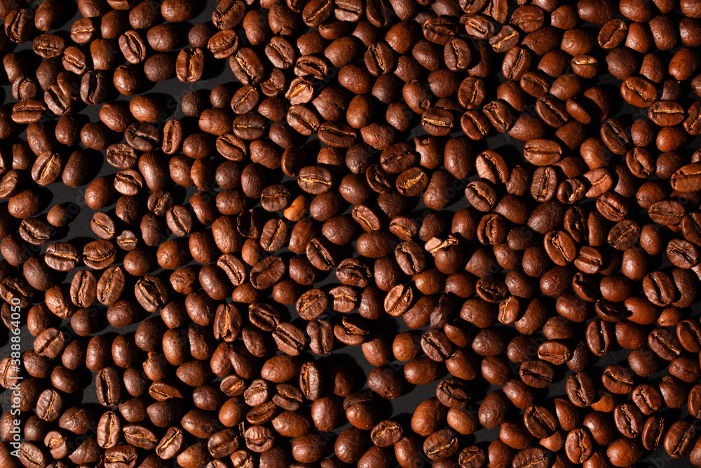 Fototapeta premium brown coffee beans, background texture, close-up. Top view.