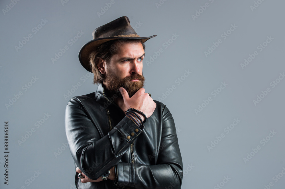mature bearded man. confidence and charisma. handsome man wear cowboy hat. male beauty and fashion. brutal biker with perfect beard and moustache. western man in leather jacket. Brave cowboy