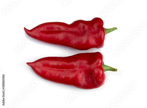 Two red bell peppers lie side by side on a white background.Isolate.