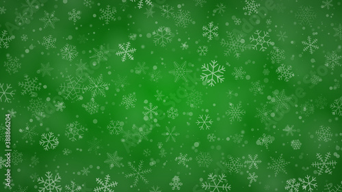 Christmas background of snowflakes of different shapes, sizes and transparency in green colors