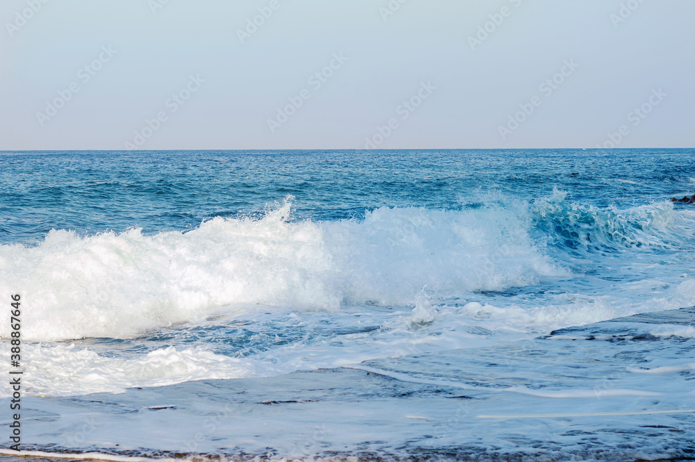 Pier and waves on the Mediterranean Sea in Turkey. Macrophoto. Turquoise background of water. Summer seascape. The concept and idea of travel. Copy space. Sea panorama. Pier and waves on the Mediterranean Sea in Turkey. Macrophoto. Turquoise background of water. Summer seascape. The concept and idea of travel. Copy space. Sea panorama.