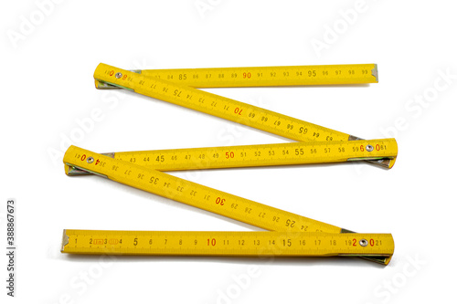 Murais de parede Isolated a yellow folding rule