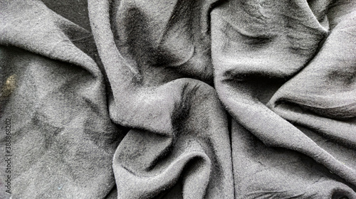 Gray fabric background. Crumpled fabric. View from above. Flat lay
