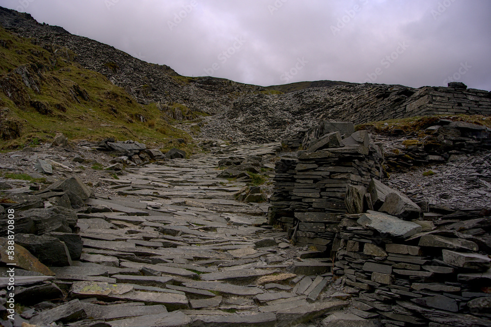 A wide slate mountain path leading upwards