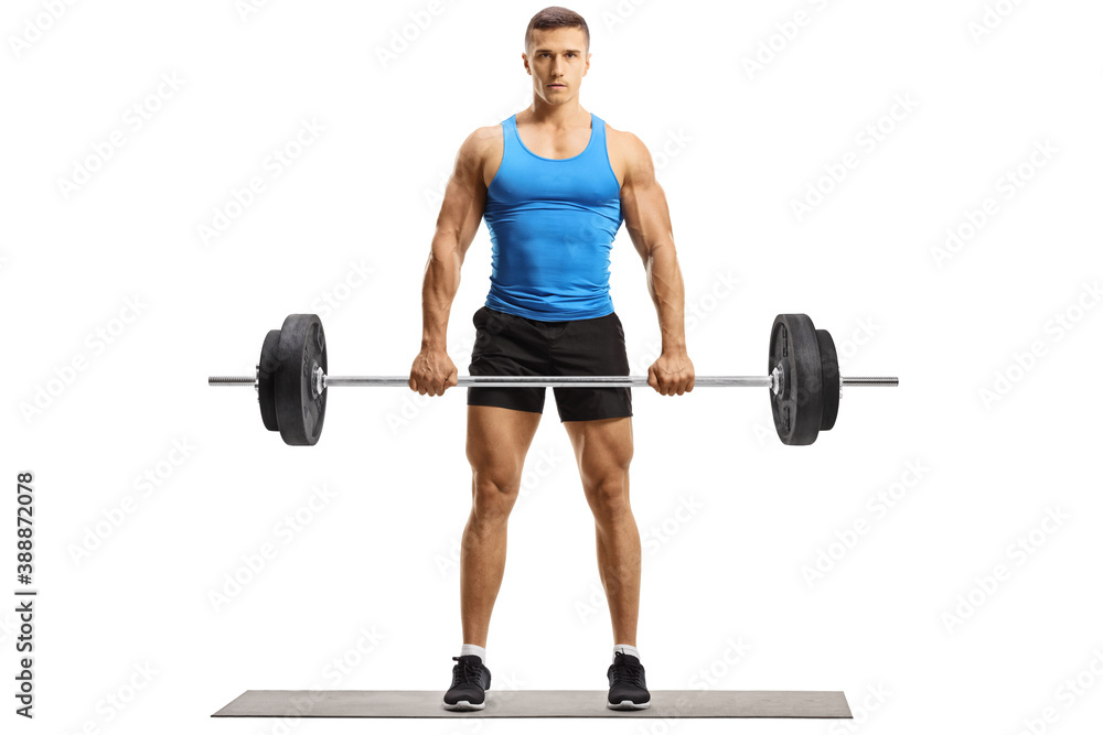 Full length portrait of fit young man in sportswear lifting weights Full length portrait of fit young man in sportswear lifting weights