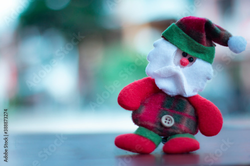 santa claus doll with bokeh background