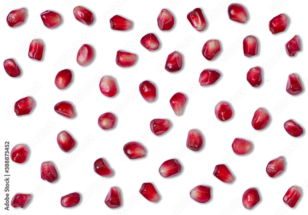 red pomegranate grains scattered and isolated on white background red pomegranate grains scattered and isolated on white background
