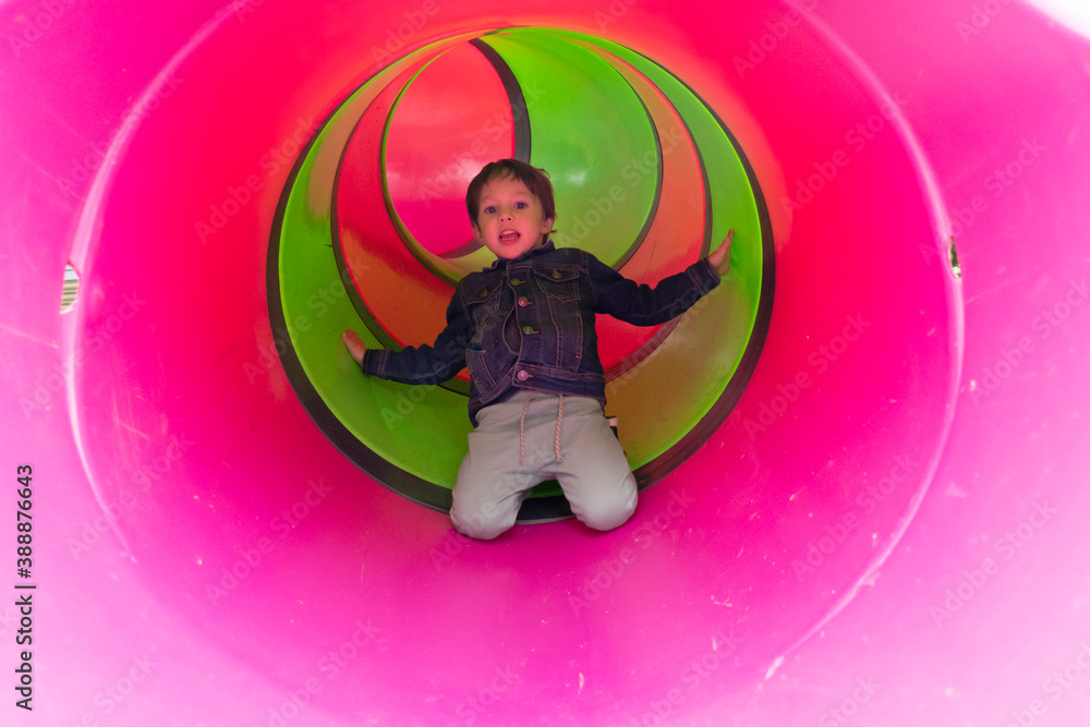 boy jumping tube slide boy jumping tube slide