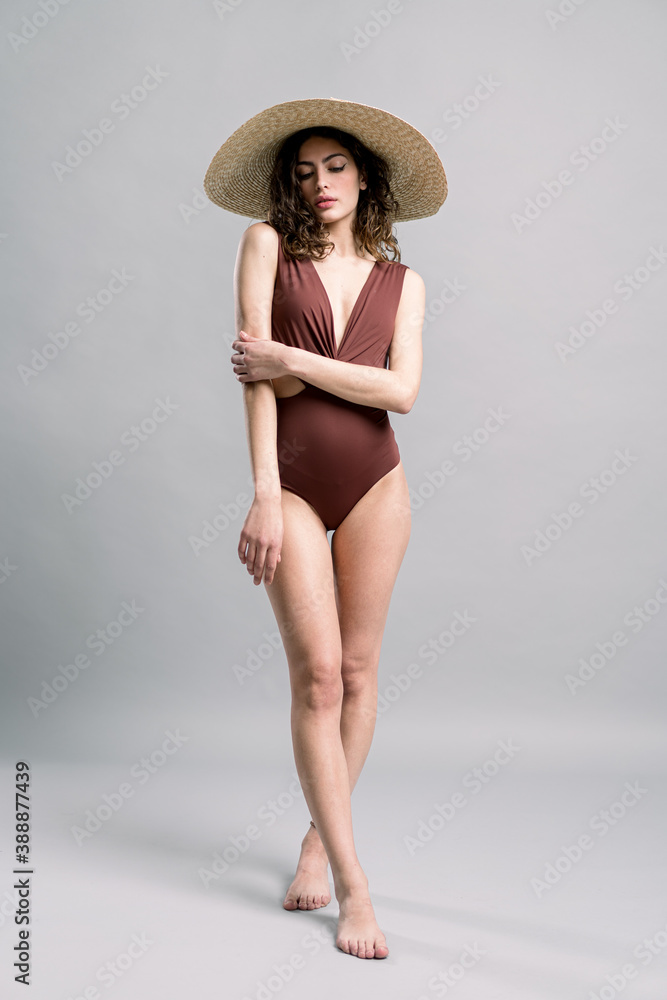 Trendy lady in swimwear and summer hat Trendy lady in swimwear and summer hat