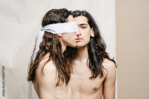 Androgynous models with naked torsos photo