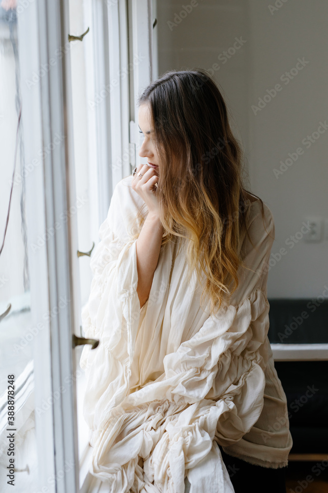 Stylish female sitting near window Stylish female sitting near window