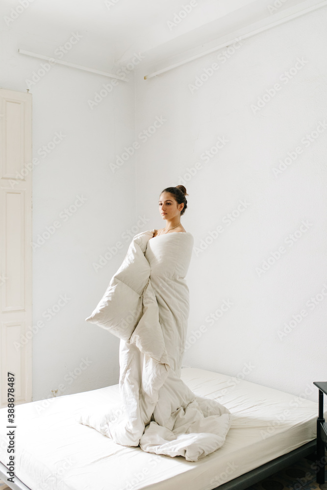 Young woman wrapping in blanket Young woman wrapping in blanket