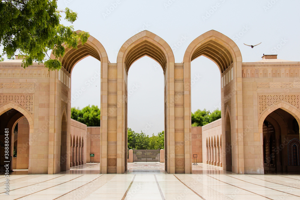 Islamic architecture. Picturesque archways in Mosque, Muscat. Bird, no people