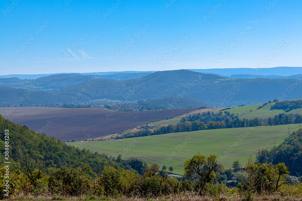Colorful landscape with high mountains, green forest, blue sky. Czech Republic