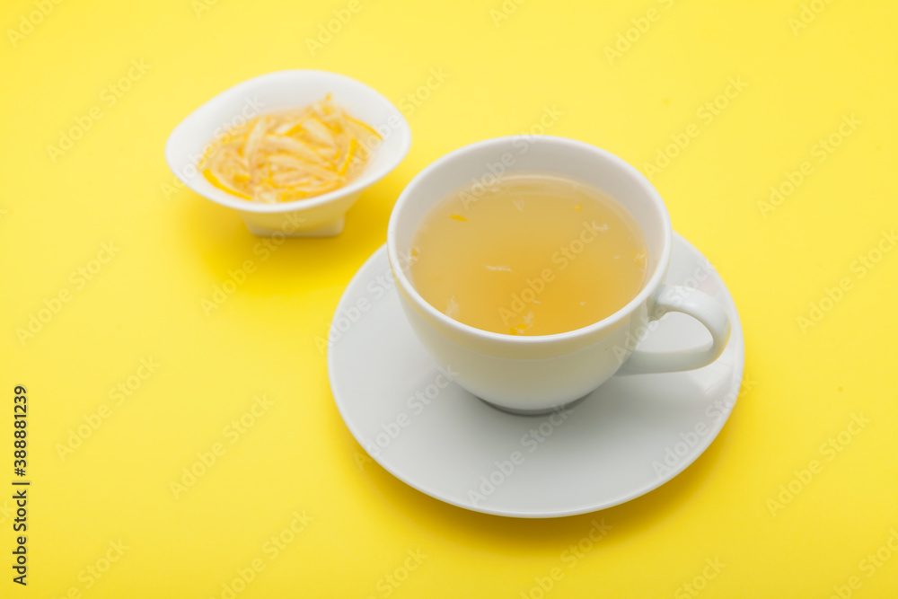 Yujacha (yuja tea or yuzu tea) - Popular Korean tea. Honey citron beverage. Yellow background, selective focus Yujacha (yuja tea or yuzu tea) - Popular Korean tea. Honey citron beverage. Yellow background, selective focus