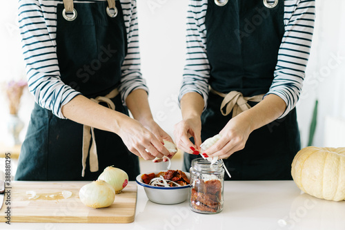 Unrecognizablewomen cooking lunch together photo