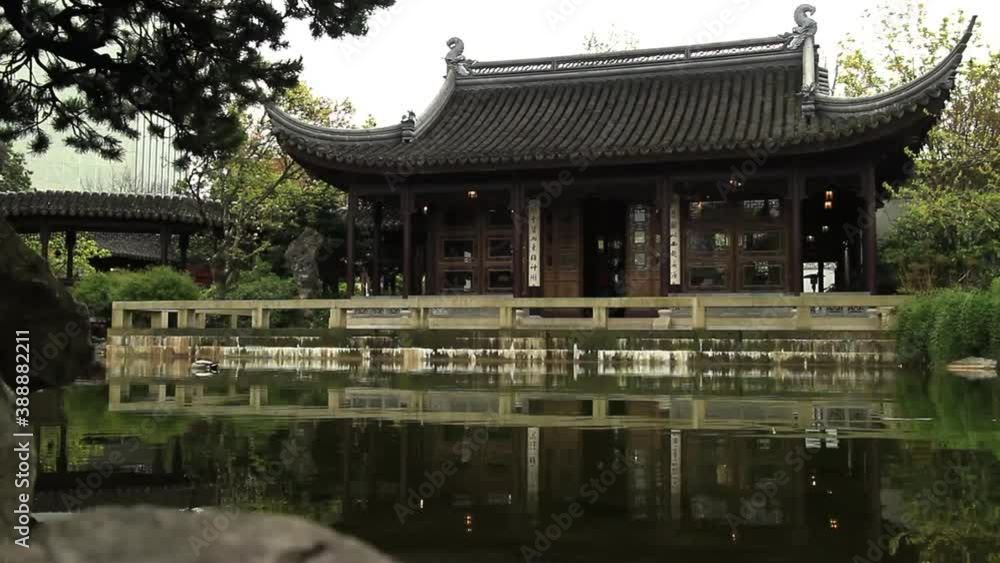 Portland, Oregon - April, 2013 - Hall of Brocade Clouds reflecting on Lake Zither in Lan Su Chinese Garden. Portland, Oregon - April, 2013 - Hall of Brocade Clouds reflecting on Lake Zither in Lan Su Chinese Garden.