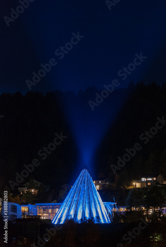 The scenery of night Karasjok village with blue illuminated Sami parliament building, Norway photo