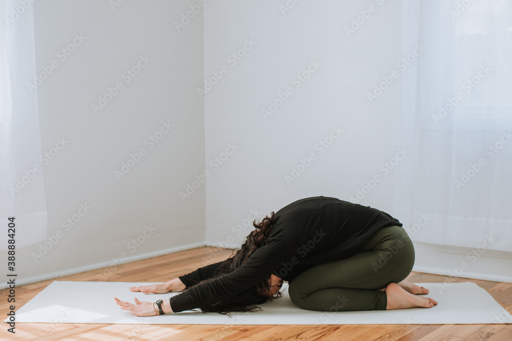 Beautiful Asian Woman Practicing Yoga in Home Beautiful Asian Woman Practicing Yoga in Home