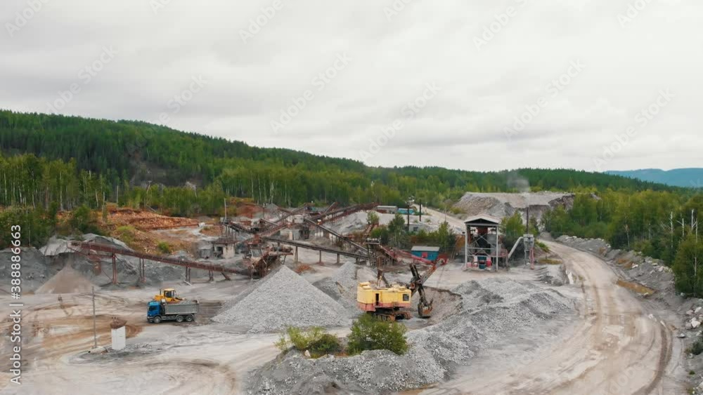 Mining grey rocks in the middle of the forest at moody day Mining grey rocks in the middle of the forest at moody day