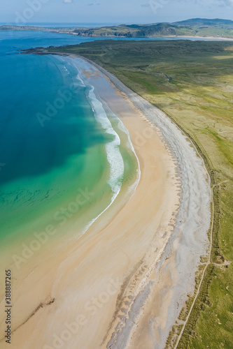 Aerial view of a long beach and the sea. photo