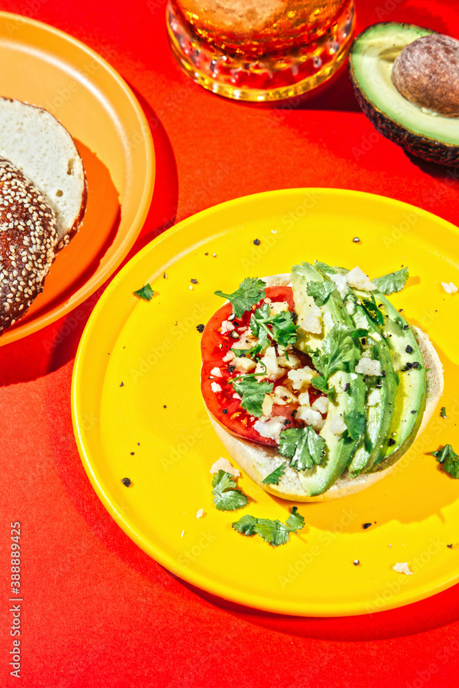 Avocado toast with tomato, cheese and fresh coriander. Avocado toast with tomato, cheese and fresh coriander.