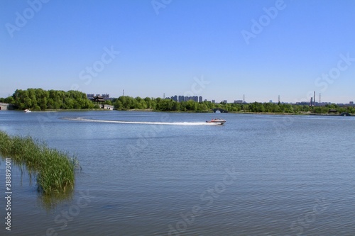 Speed boat sailing in the lake in summer