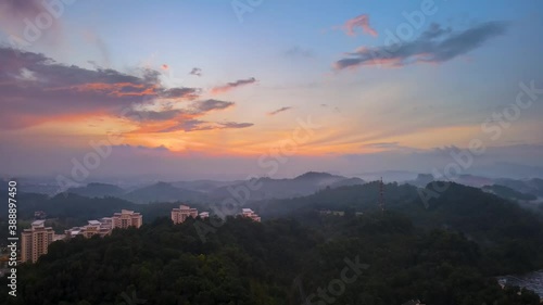 Aerial Drone 4K UHD anamorphic with Desqueeze factor of 1.15x 1.33x view of 5G Communication tower on top of hill view during beautiful sunrise. photo