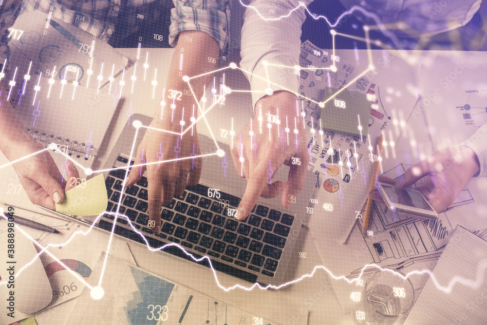 Multi exposure of man and woman working together and forex graph hologram drawing. Financial analysis concept. Computer background. Top View. Multi exposure of man and woman working together and forex graph hologram drawing. Financial analysis concept. Computer background. Top View.