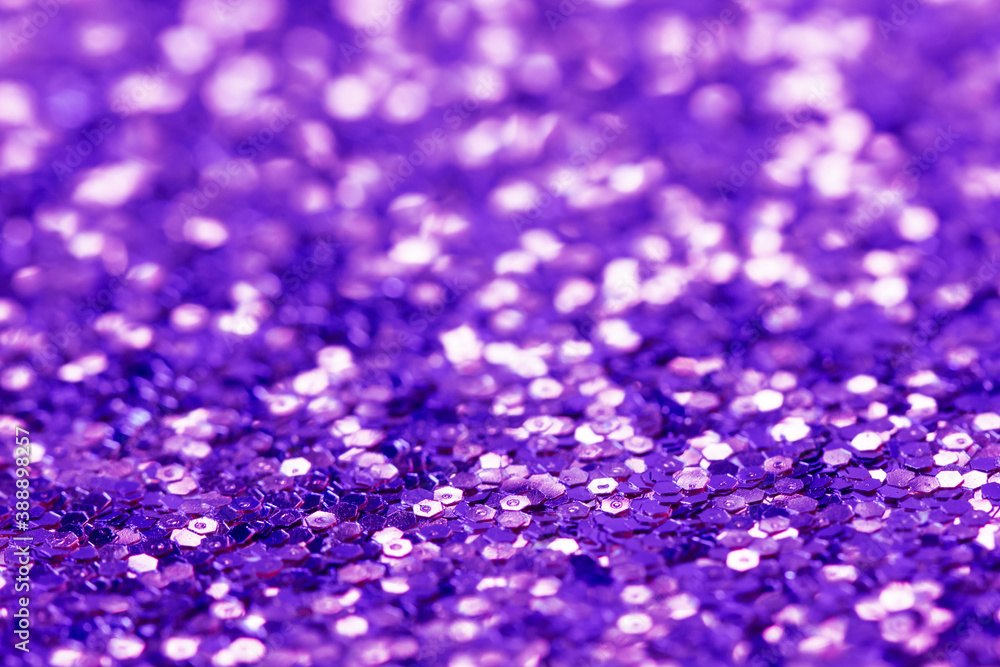 Abstract festive purple background. Blurred glitter texture. Abstract festive purple background. Blurred glitter texture.