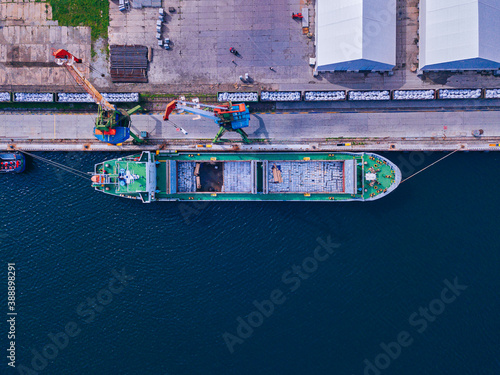 Russia,�Primorsky�Krai, Zarubino, Aerial view of container ship moored in commercial dock photo