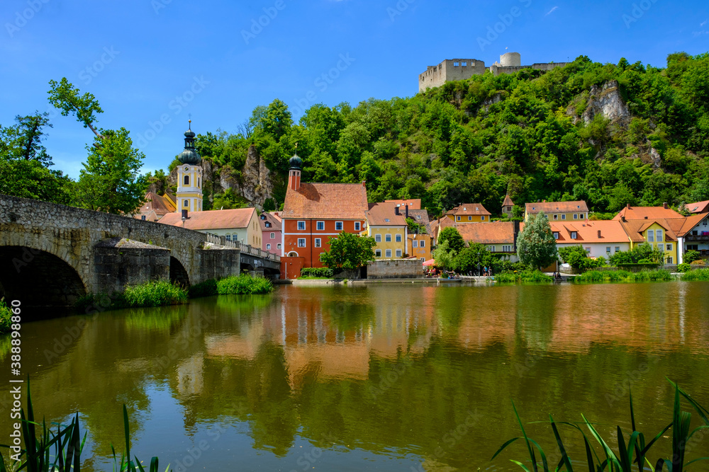 Germany, Bavaria, Kallmunz, Arch bridge over River Naab and riverside town houses in summer Germany, Bavaria, Kallmunz, Arch bridge over River Naab and riverside town houses in summer