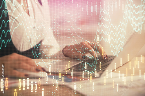 Double exposure of businesswoman hands typing on computer and forex graph hologram drawing. Financial analysis concept.