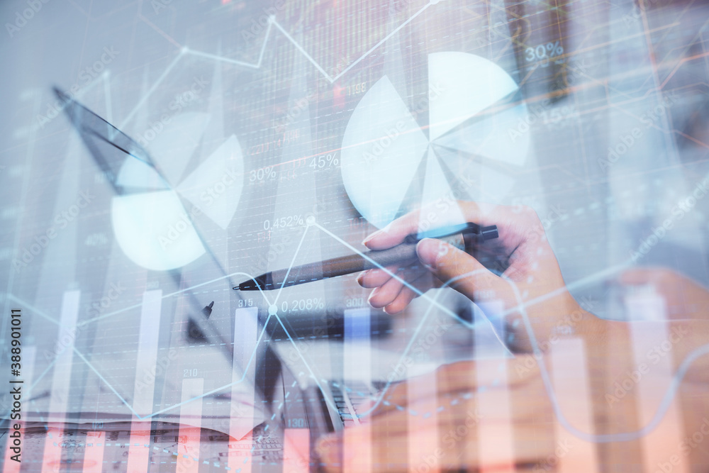 Multi exposure of woman hands typing on computer and financial graph hologram drawing. Stock market analysis concept. Multi exposure of woman hands typing on computer and financial graph hologram drawing. Stock market analysis concept.