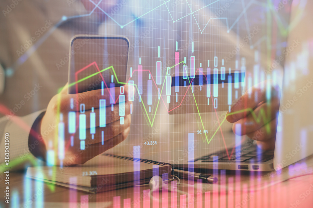 Double exposure of man hands holding a credit card and Forex graph drawing. Stock trading and digital fintech in Internet E-commerce concept.