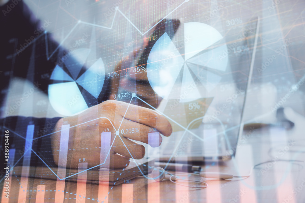 Double exposure of man's hands holding and using a phone and financial graph drawing. Analysis concept. Double exposure of man's hands holding and using a phone and financial graph drawing. Analysis concept.
