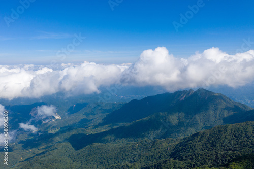 Fototapeta Naklejka Na Ścianę i Meble -  Aerial photography of blue sky and white clouds on the mountain