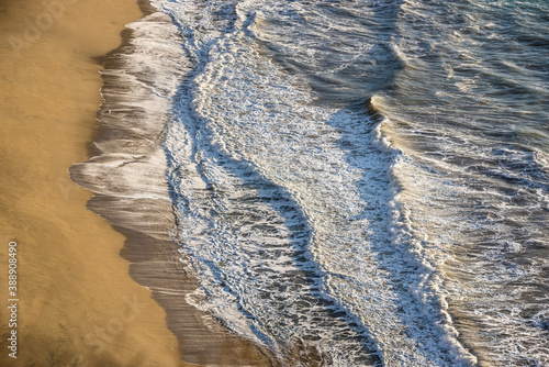 Closeup of waves crashing somewhere in the Californa coast. photo