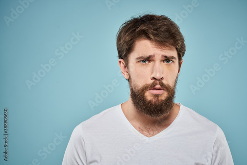 Bearded man emotions white t-shirt lifestyle gestures with hands blue backgrounds