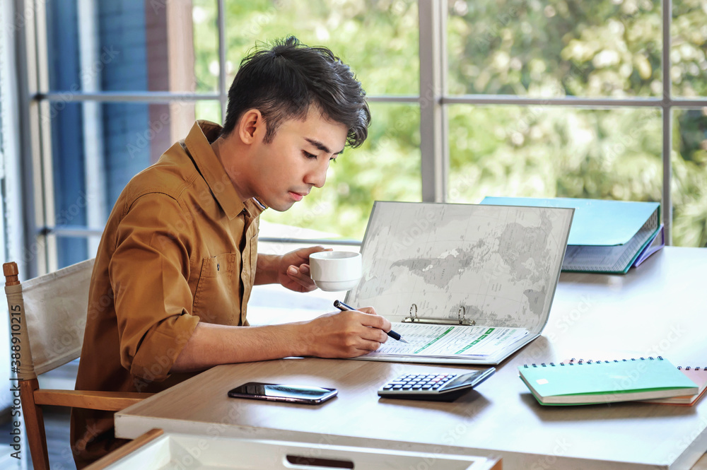 businessman working on documents with hand holding pen checking analysis budget on desk in office. concept finance and accounting businessman working on documents with hand holding pen checking analysis budget on desk in office. concept finance and accounting