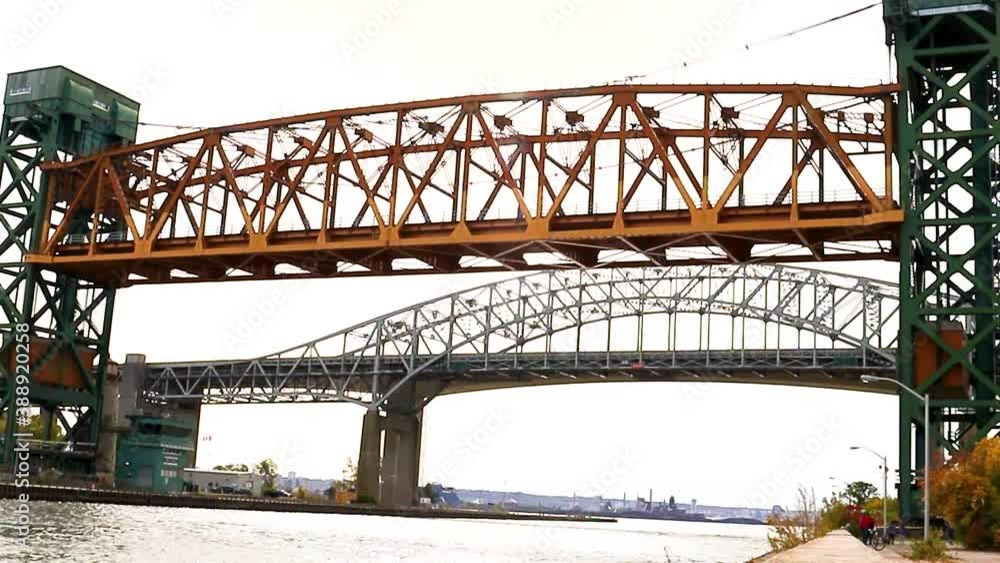 A Canadian lift bridge descends from its maximum height to three-quarters of its travel. A Canadian lift bridge descends from its maximum height to three-quarters of its travel.