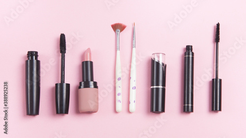 Beautiful cosmetic accessories on a pink background.