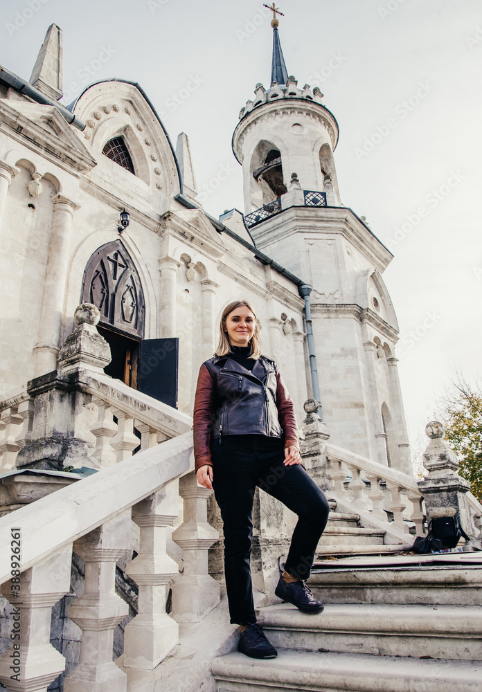 woman standing on large stone staircase old historical temple fortress building church 